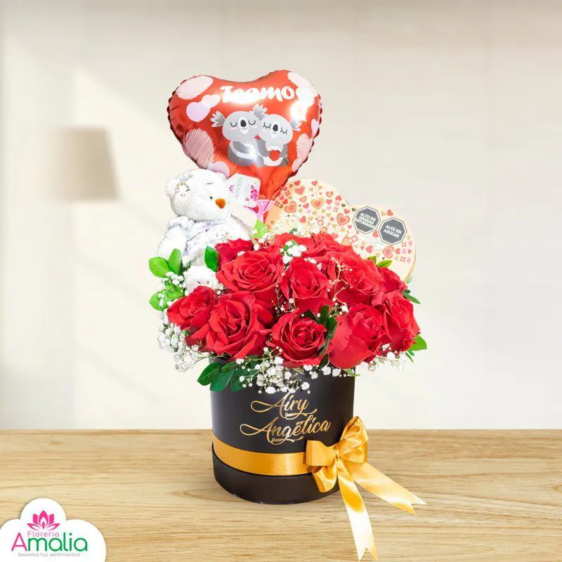 Box rosas rojas en caja de regalo con peluche y globo en forma de corazón con la frase 'Te amo', y caja de chocolates princesa, ideal para ocasiones románticas.