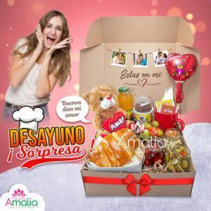 🥐 "Desayuno Sorpresa" en una caja grande con oso de peluche, croissants, globos y frutas frescas. Un regalo ideal para alegrar el día.