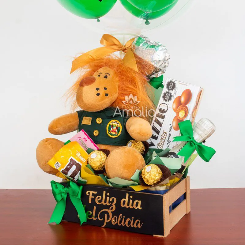 Caja decorativa con peluche temático de policía, globo personalizado, chocolates Ferrero Rocher y otros detalles, ideal para sorprender en el Día del Policía.